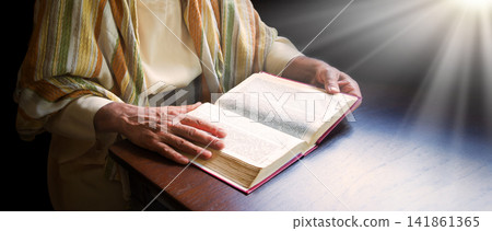 Old man reading a big book Old man reading a big book 141861365