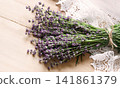 Lavender flowers lie on the table on lace 141861379