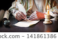 Male hand witn big quill 141861386