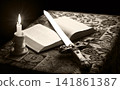 Old sword on the bible 141861387