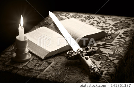Old sword on the bible Old sword on the bible 141861387