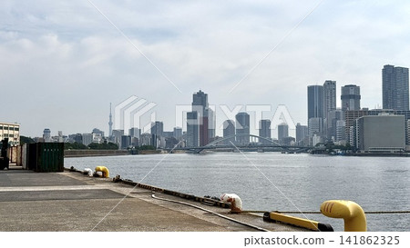 View of the tower apartment buildings, warehouses, and harbor along the Tokyo Bay waterfront from Takeshiba Pier View of the tower apartment buildings, warehouses, and harbor along the Tokyo Bay waterfront from Takeshiba Pier 141862325
