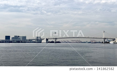 A view of Tokyo Bay, the Rainbow Bridge, and the harbor scenery from Takeshiba Pier. A view of Tokyo Bay, the Rainbow Bridge, and the harbor scenery from Takeshiba Pier. 141862582
