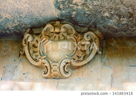 Architectural details on building, stone carving, aesthetic frills. Architectural details on building, stone carving, aesthetic frills. 141863418