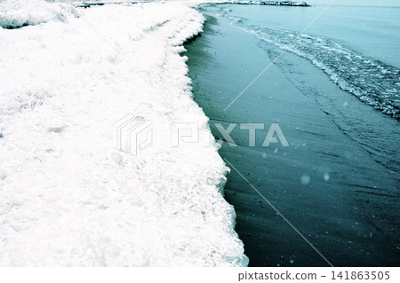 first snow on the beach first snow on the beach 141863505