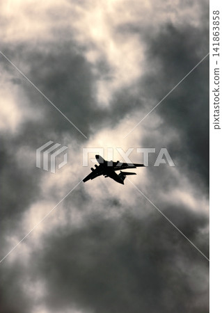 Jet plane on background of cloudy sky Jet plane on background of cloudy sky 141863858
