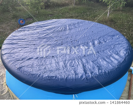 Inflatable pool set up outside city Inflatable pool set up outside city 141864460