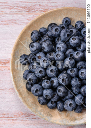 Fresh, ripe, and juicy wild blueberries as an ingredient for vegetarian dishes Fresh, ripe, and juicy wild blueberries as an ingredient for vegetarian dishes 141866300