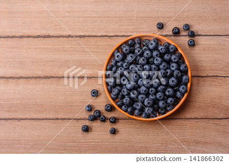 Fresh, ripe, and juicy wild blueberries as an ingredient for vegetarian dishes Fresh, ripe, and juicy wild blueberries as an ingredient for vegetarian dishes 141866302
