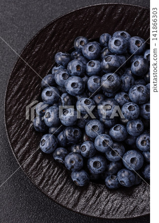 Fresh, ripe, and juicy wild blueberries as an ingredient for vegetarian dishes Fresh, ripe, and juicy wild blueberries as an ingredient for vegetarian dishes 141866303