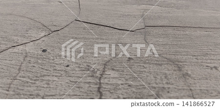 Cracked gray concrete surface texture 141866527