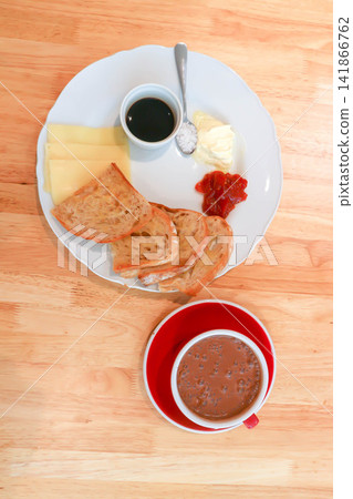 sourdough bread or bread or whole wheat bread or sliced bread with cranberry sauce ,honey and cheese served with hot cocoa sourdough bread or bread or whole wheat bread or sliced bread with cranberry sauce ,honey and cheese served with hot cocoa 141866762