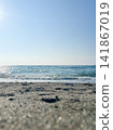 Waves crashing onto the sandy beach in summer 141867019