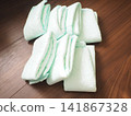 A urine pad placed on the floor 141867328