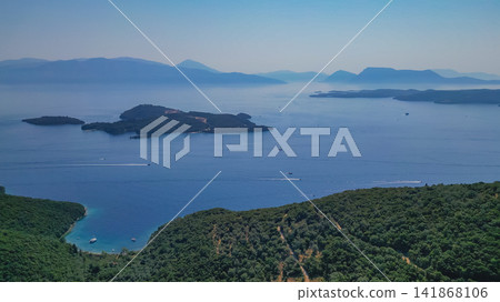Panoramic drone view of Skorpios and Meganisi islands in Ionian Sea off eastern coast of Lefkada Greece with boats sailing on turquoise water for summer holiday Panoramic drone view of Skorpios and Meganisi islands in Ionian Sea off eastern coast of Lefkada Greece with boats sailing on turquoise water for summer holiday 141868106