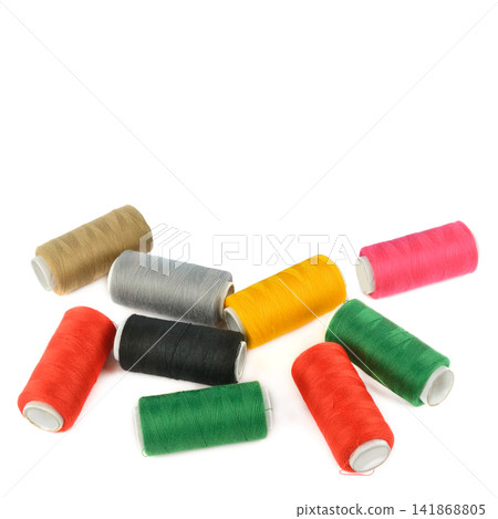 Colorful Sewing Thread Spools Isolated on White Background Colorful Sewing Thread Spools Isolated on White Background 141868805