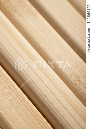 Diagonal slats made of natural wood in warm color Diagonal slats made of natural wood in warm color 141869103
