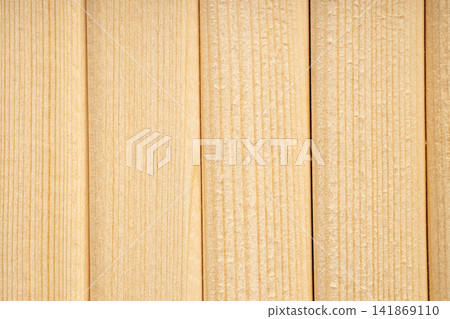 A background of vertical strips of natural wood in warm color A background of vertical strips of natural wood in warm color 141869110