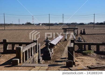 A small shrine nestled in the countryside and a rural landscape A small shrine nestled in the countryside and a rural landscape 141869144