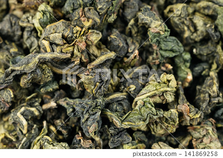 Macro dried tea leaf surface fullframe Tie Guan Yin background Macro dried tea leaf surface fullframe Tie Guan Yin background 141869258