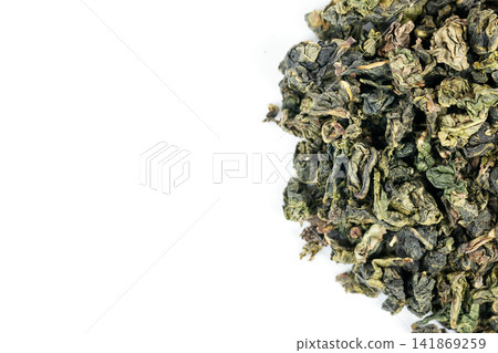 Green oolong tea closeup with white backdrop Green oolong tea closeup with white backdrop 141869259