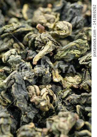 Premium oolong tea leaf background for texture and detail Premium oolong tea leaf background for texture and detail 141869262