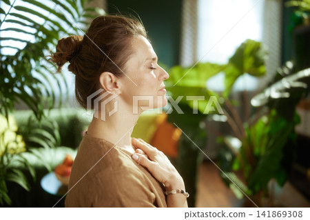 Peaceful Profile of a Woman Engaged in Self-Compassion Ritual Peaceful Profile of a Woman Engaged in Self-Compassion Ritual 141869308