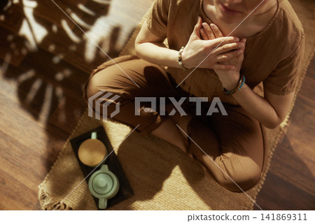 Mindful Reflection with Tea and Heart-Centered Pose Mindful Reflection with Tea and Heart-Centered Pose 141869311