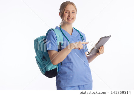 Confident Nursing Student Pointing to Tablet Screen Confident Nursing Student Pointing to Tablet Screen 141869514