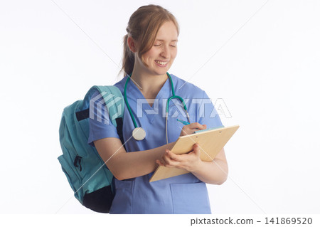 Smiling Student Nurse Taking Clinical Notes with Clipboard 141869520
