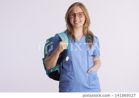 Smiling Medical Student with Glasses and Backpack Smiling Medical Student with Glasses and Backpack 141869527