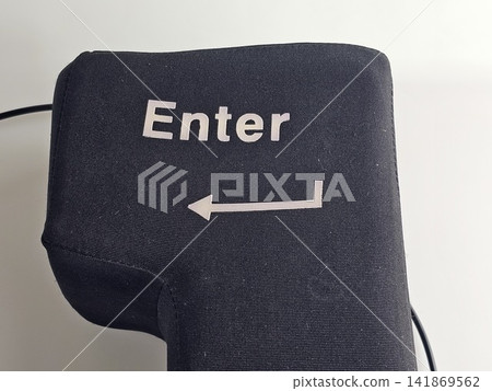 Close-Up of Oversized Enter Key with White Arrow Symbol Close-Up of Oversized Enter Key with White Arrow Symbol 141869562
