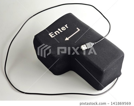 Oversized USB Enter Button with Plug Resting on Soft Key Oversized USB Enter Button with Plug Resting on Soft Key 141869569