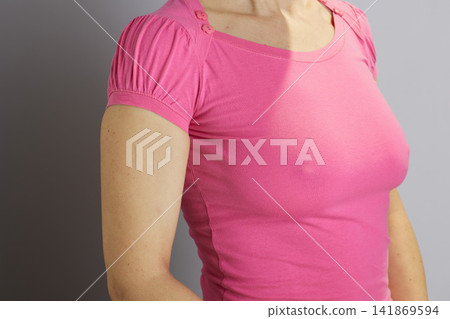 Female Torso in Pink T-shirt for Preventive Health Awareness Female Torso in Pink T-shirt for Preventive Health Awareness 141869594