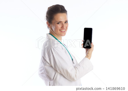 Smiling Female Physician Holding Smartphone for Telemedicine Smiling Female Physician Holding Smartphone for Telemedicine 141869610
