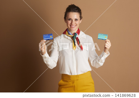 Professional Woman Presenting Two Credit Cards Professional Woman Presenting Two Credit Cards 141869628