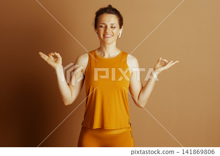 Woman in Activewear Meditating with Gyan Mudra Woman in Activewear Meditating with Gyan Mudra 141869806