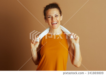 Cheerful Woman Radiates Post-Workout Energy Cheerful Woman Radiates Post-Workout Energy 141869809