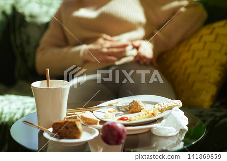 Feeling Nauseous and Bloated After Excessive Eating Feeling Nauseous and Bloated After Excessive Eating 141869859