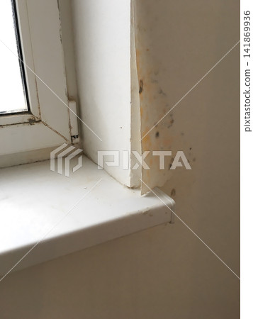 Close up of a white window frame with visible dirt and marks on the sill. Close up of a white window frame with visible dirt and marks on the sill. 141869936
