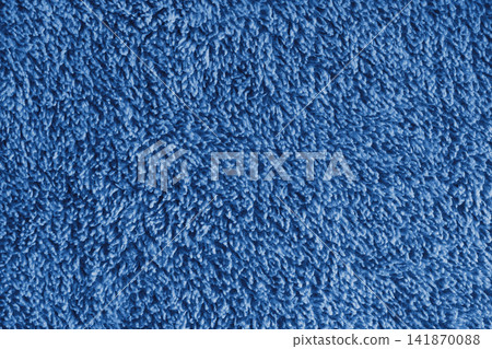 Macro of blue microfiber bath towel, soft fluffy fabric, absorbent material texture background Macro of blue microfiber bath towel, soft fluffy fabric, absorbent material texture background 141870088