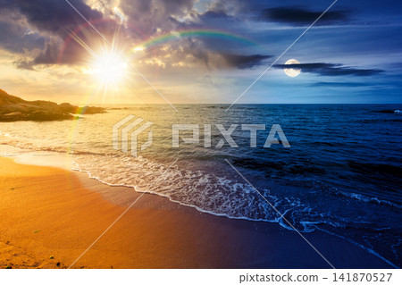 black sea landscape on summer solstice. day meet night. sun and moon over bulgaria nature landscape with sandy beach. vacation at the sea shore concept. waves and empty beach. remote astrology scene black sea landscape on summer solstice. day meet night. sun and moon over bulgaria nature landscape with sandy beach. vacation at the sea shore concept. waves and empty beach. remote astrology scene 141870527