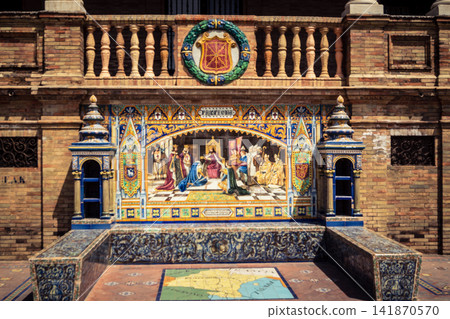 General view of ceramic tile bench alcove with coat of arms at Plaza of Spain in Seville General view of ceramic tile bench alcove with coat of arms at Plaza of Spain in Seville 141870570