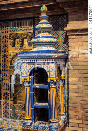 Vertical view of decorative ceramic tile column between provincial bench alcoves at Plaza of Spain in Seville Vertical view of decorative ceramic tile column between provincial bench alcoves at Plaza of Spain in Seville 141870644