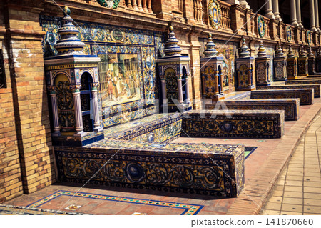 General view of ceramic tile bench alcove with coat of arms at Plaza of Spain in Seville General view of ceramic tile bench alcove with coat of arms at Plaza of Spain in Seville 141870660