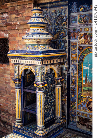 Vertical view of decorative ceramic tile column between provincial bench alcoves at Plaza of Spain in Seville 141870945