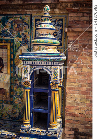 Vertical view of decorative ceramic tile column between provincial bench alcoves at Plaza of Spain in Seville Vertical view of decorative ceramic tile column between provincial bench alcoves at Plaza of Spain in Seville 141870965