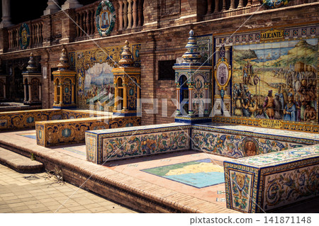 General view of ceramic tile bench alcove with coat of arms at Plaza of Spain in Seville General view of ceramic tile bench alcove with coat of arms at Plaza of Spain in Seville 141871148