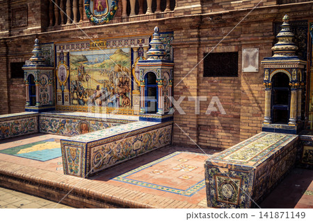 General view of ceramic tile bench alcove with coat of arms at Plaza of Spain in Seville General view of ceramic tile bench alcove with coat of arms at Plaza of Spain in Seville 141871149