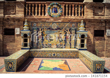 General view of ceramic tile bench alcove with coat of arms at Plaza of Spain in Seville General view of ceramic tile bench alcove with coat of arms at Plaza of Spain in Seville 141871154